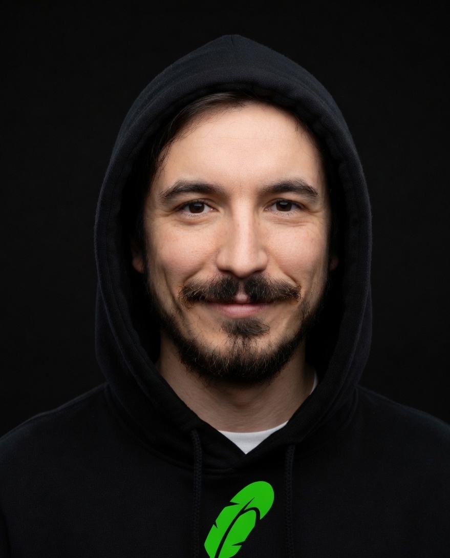 Vlad smiling in a black hood