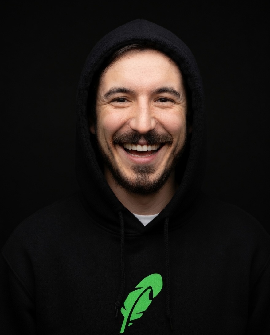 Vlad laughing in a black hood